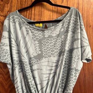 Kealopiko romper light blue gray in color.